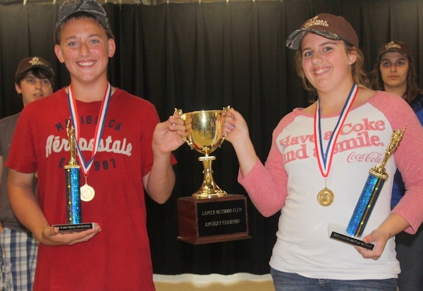 Eighth grade archers Curtis Taylor and Alexis Felton will have their named etched into this trophy after the earned top honors at their school's first archery tournament on Thursday.