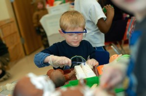 In addition to reading, preschool students also have the opportunity to work with older students on fun activities and projects.