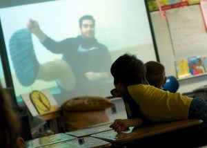 Mayfield Elementary students watch a video produced by West students Justin Amante and Justin Englehart. As you might guess from the photo, it is a signing of the Dr. Suess "Foot Book."